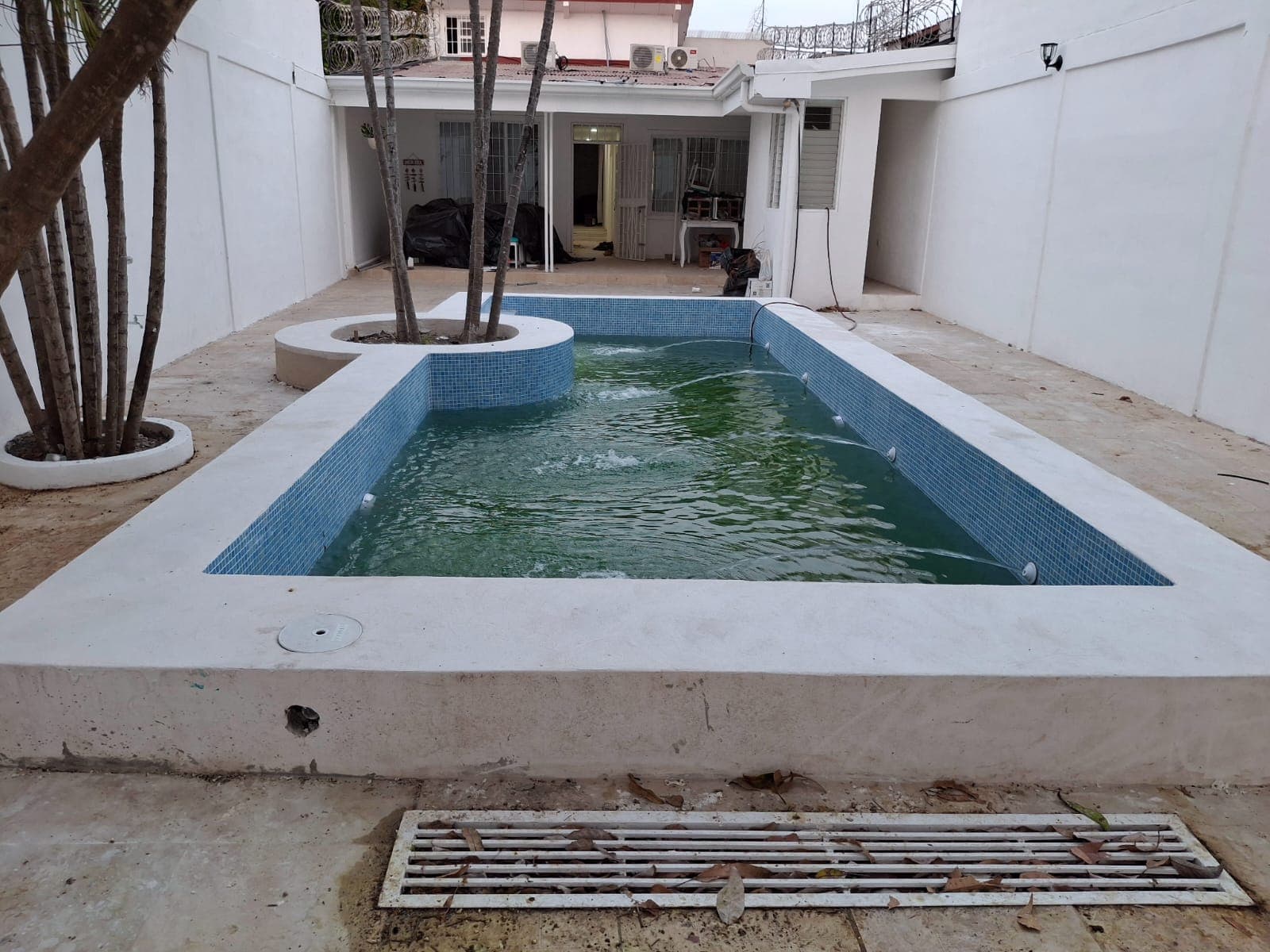 Large rectangular pool near completion, full water fill